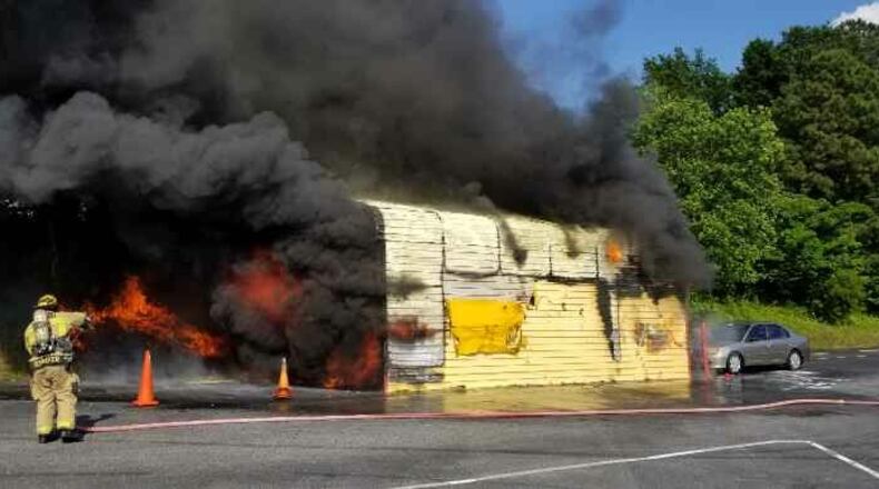 A vehicle caught fire inside a Gwinnett County emissions shed Tuesday afternoon.