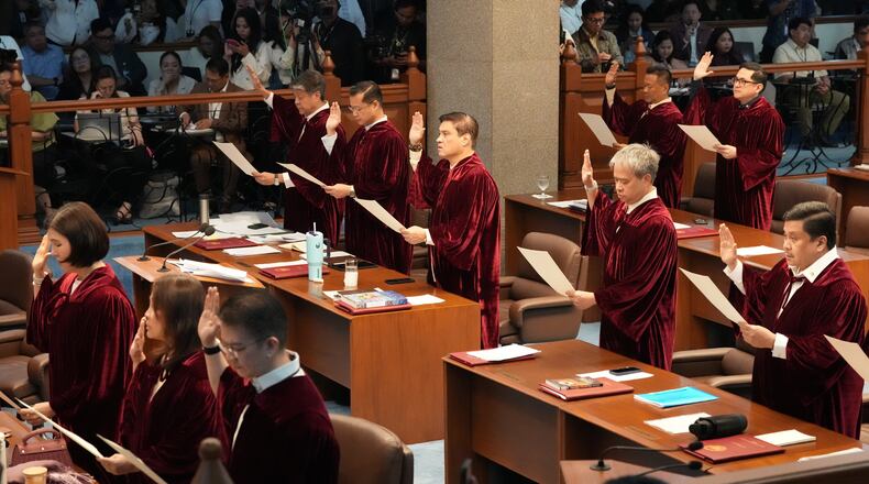 Philippine senators take oath as they convene as an impeachment court for the trial of Vice President Sara Duterte at the Philippine senate, Monday, May 18, 2026, in Pasay, Philippines. (AP Photo/Aaron Favila)