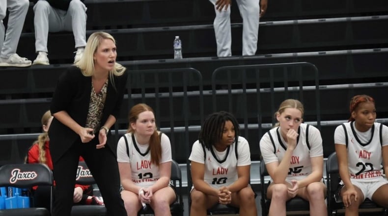 Jackson County girls basketball coach Mackenzie Sandy on the sideline during a game on Dec. 5. (Photo by Popi Marquez)