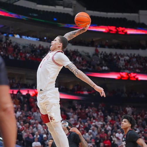 Arkansas forward Trevon Brazile drives in for a dunk during the second half of an NCAA college basketball game against Texas Tech, Saturday, Dec. 13, 2025, in Dallas. (AP Photo/LM Otero)