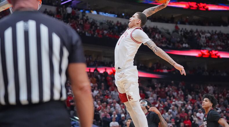 Arkansas forward Trevon Brazile drives in for a dunk during the second half of an NCAA college basketball game against Texas Tech, Saturday, Dec. 13, 2025, in Dallas. (AP Photo/LM Otero)