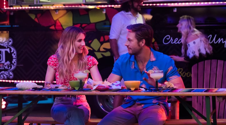 L to R: Emma Roberts as Sloane Reed and Luke Bracey as Jackson Pieretti in "Holidate." Photo: Steve Dietl/Netflix