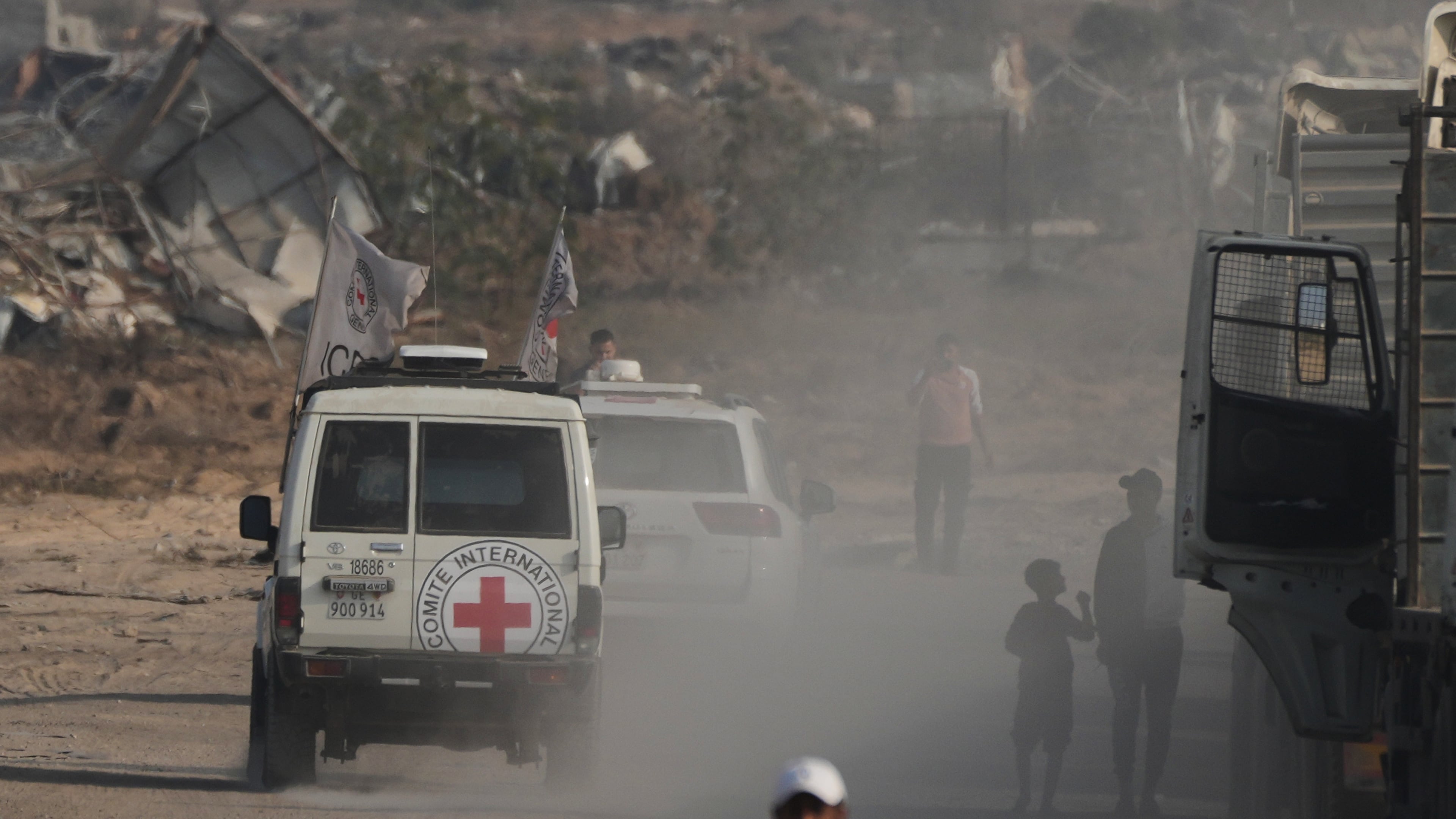 Red Cross convoy carrying what Hamas claims is the remains of an Israeli soldier who was killed in Gaza in 2014 and whose body has been held in Gaza since. makes its way toward the border crossing with Israel, to be transferred to Israeli authorities, in Deir al-Balah, Gaza Strip, Sunday, Nov. 9, 2025. (AP Photo/Jehad Alshrafi)