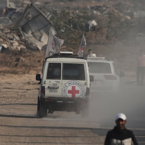 Red Cross convoy carrying what Hamas claims is the remains of an Israeli soldier who was killed in Gaza in 2014 and whose body has been held in Gaza since. makes its way toward the border crossing with Israel, to be transferred to Israeli authorities, in Deir al-Balah, Gaza Strip, Sunday, Nov. 9, 2025. (AP Photo/Jehad Alshrafi)