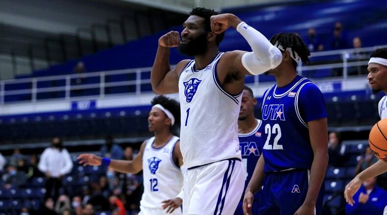 Georgia State Eliel Nsoseme, flexes his muscles after making a power move against Texas-Arlington.