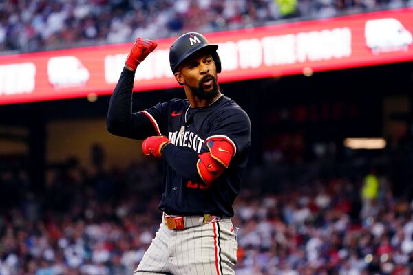 Minnesota Twins' Byron Buxton celebrates after hitting a triple against the Atlanta Braves during the third inning of a baseball game Saturday, April 19, 2025, in Atlanta. (AP Photo/ John David Mercer)
