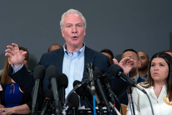 Sen. Chris Van Hollen, D-Md., speaks during a news conference upon his arrival from meeting with Kilmar Abrego Garcia in El Salvador, at Washington Dulles International Airport, in Chantilly, Va., Friday, April 18, 2025, in Washington. (AP Photo/Jose Luis Magana)