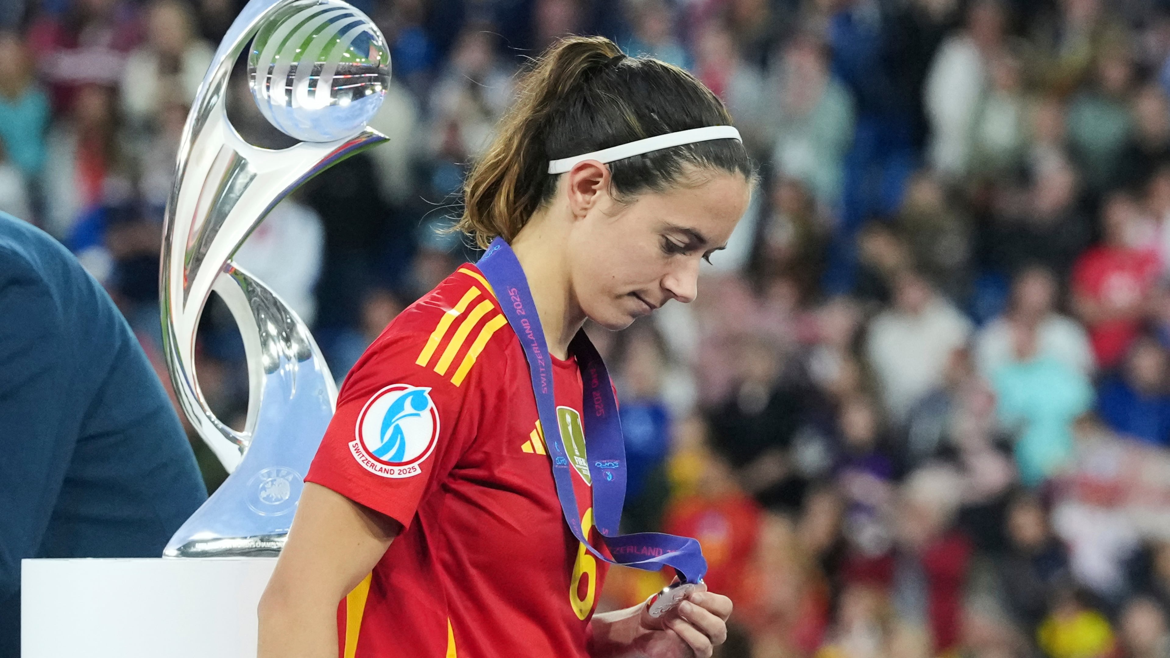 FILE - Spain's Aitana Bonmati walks past the trophy with her runners up medal after the Women's Euro 2025 final soccer match between England and Spain at St. Jakob-Park in Basel, Switzerland, Sunday, July 27, 2025. (AP Photo/Martin Meissner, File)