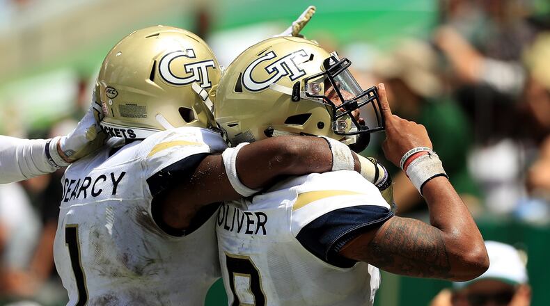 TAMPA, FL - SEPTEMBER 08: Tobias Oliver #8 of the Georgia Tech Yellow Jackets celebrates a touchdown during a game against the South Florida Bulls at Raymond James Stadium on September 8, 2018 in Tampa, Florida. (Photo by Mike Ehrmann/Getty Images)