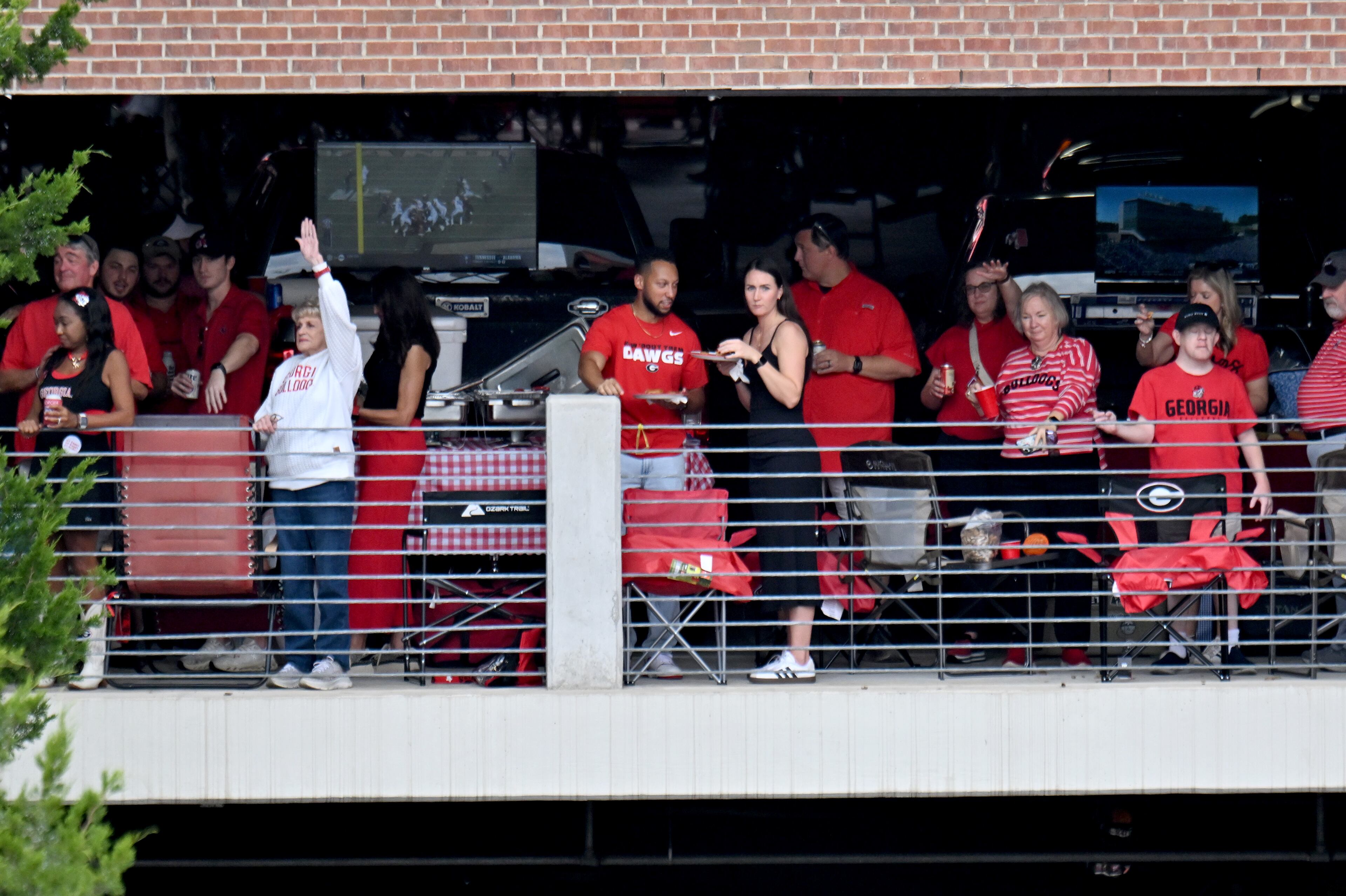 Georgia fans cheer as players and coaching staff arrive during the Dawg Walk before an NCAA football game against Mississippi at Sanford Stadium, Saturday, October 18, 2025, in Athens. (Hyosub Shin/AJC)
