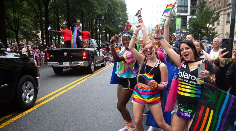 People cheer on the parade during the 49th annual Pride Festival and Parade in Atlanta in 2019.  STEVE SCHAEFER / SPECIAL TO THE AJC