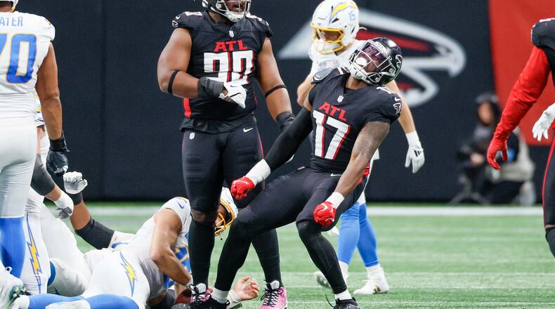 Atlanta Falcons linebacker Arnold Ebiketie (17) reacts after sacking Los Angeles Chargers quarterback Justin Herbert (10) during the first half of an NFL football game against the Los Angeles Chargers on Sunday, December 1, 2024, at Mercedes-Benz Stadium in Atlanta. 
(Miguel Martinez/ AJC)
