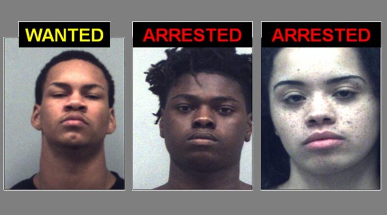 Bruce Chambers, 19, is wanted on armed robbery and aggravated assault charges in connection with a July 31 shooting. Dylan Grant, 19, (center) and Isis McCloud, 17, have been charged in connection with the same shooting.