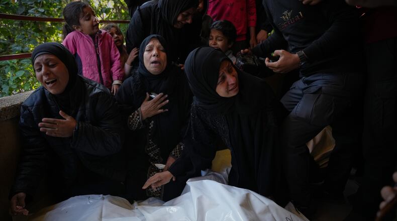 Mourners attend the funeral of Palestinians killed in an Israeli military strike, at Nasser Hospital in Khan Younis, Gaza Strip, Thursday, Dec. 4, 2025. (AP Photo/Abdel Kareem Hana)