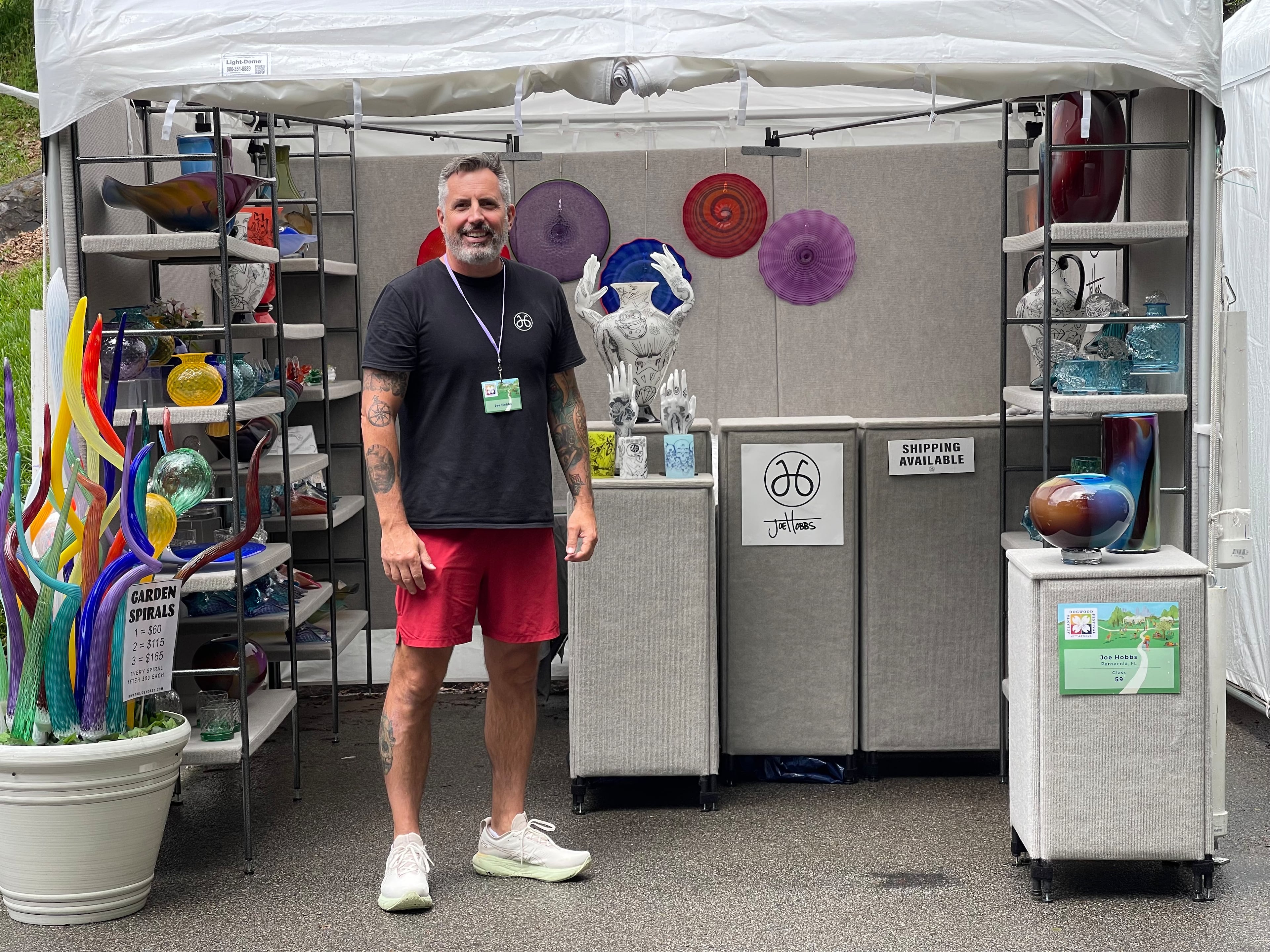 Joe Hobbs, a blown glass artist from Pensacola, Florida, shows off his wares at the Dogwood Festival in April. (Courtesy of Joe Hobbs)