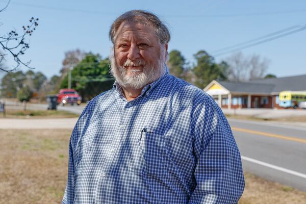 Jimmy Shackelford revisits the site of a 2017 crash in Milledgeville where a driver fleeing a Georgia State Patrol trooper hit his pickup head-on. The crash left Shackelford with severe injuries. Shackelford says that better judgment by the patrol officer might have prevented the crash. (Natrice Miller/ Natrice.miller@ajc.com)
