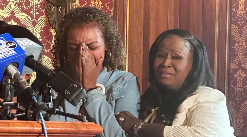 Veronica Ruiz, the sister of Corey Ruiz, who was killed by Madison police, breaks down in tears and is comforted by Wisconsin state Rep. Shelia Stubbs, D-Madison, right, Friday, July 24, 2026, in Madison, Wis. (AP Photo/Scott Bauer)