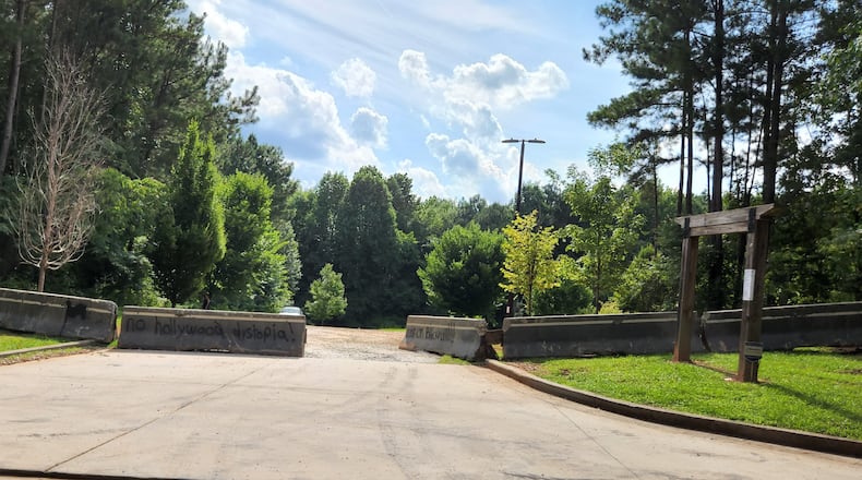 Blackhall Real Estate Phase II, an LLC controlled by film studio founder Ryan Millsap, recently installed concrete barricades at Intrenchment Creek Park's South River Trailhead. Millsap obtained the property during a controversial county land swap that is still being litigated. SPECIAL PHOTO