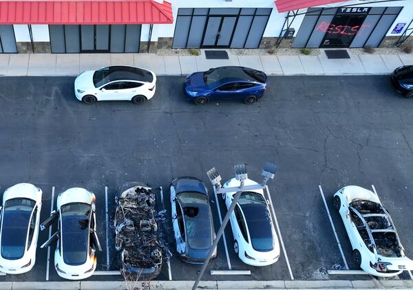 FILE - Police are investigating after several vehicles were set on fire at a Tesla service center, Tuesday, March 18, 2025, in Las Vegas. (Bizuayehu Tesfaye/Las Vegas Review-Journal via AP, File_
