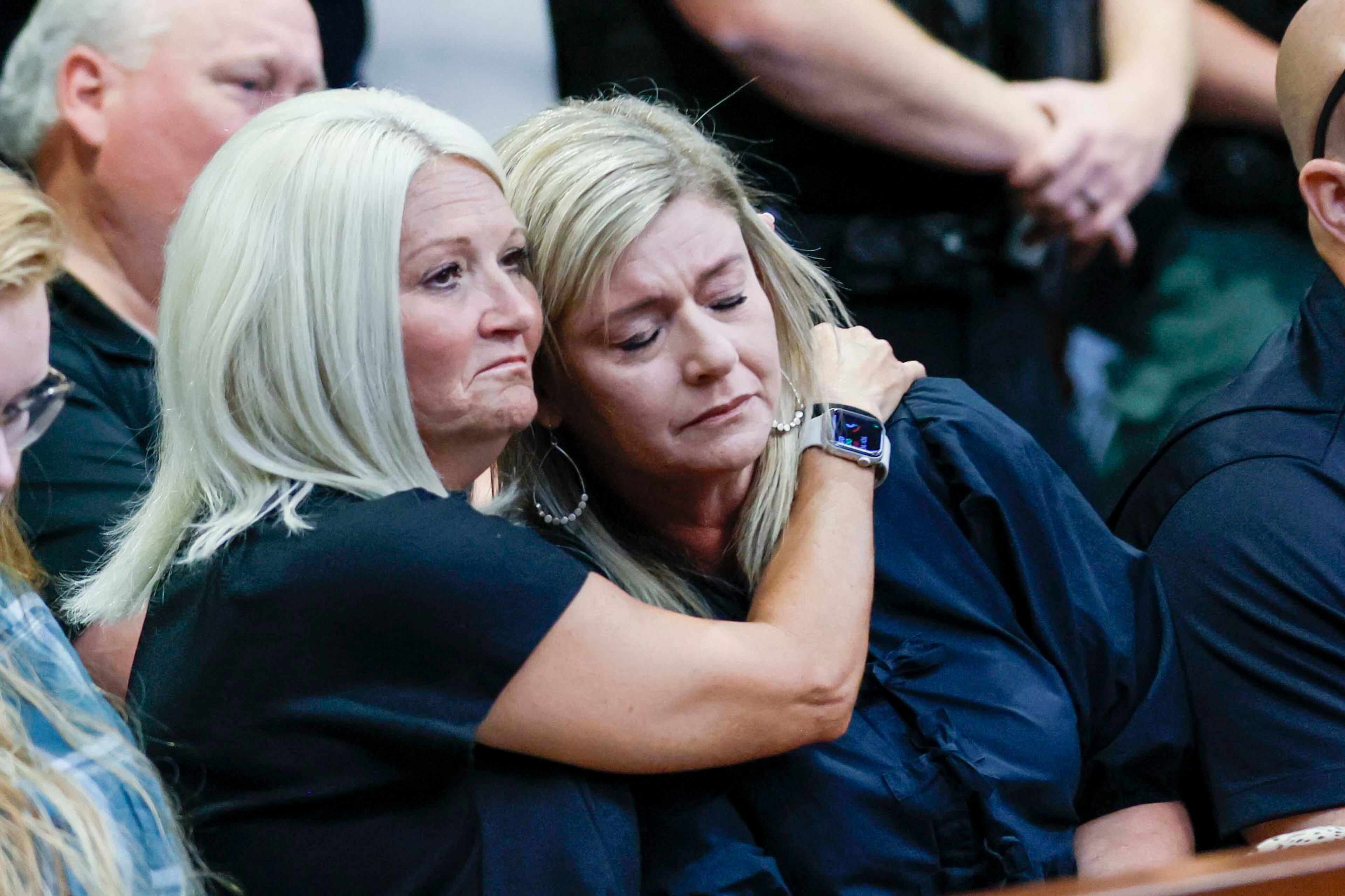 Kellie Lindsey (left) embraces her friend Julie Evenson after both spoke during the sentencing hearing for Anthony Scott at the Carroll County courthouse on Wednesday, Oct. 1, 2025. (Miguel Martinez/AJC)