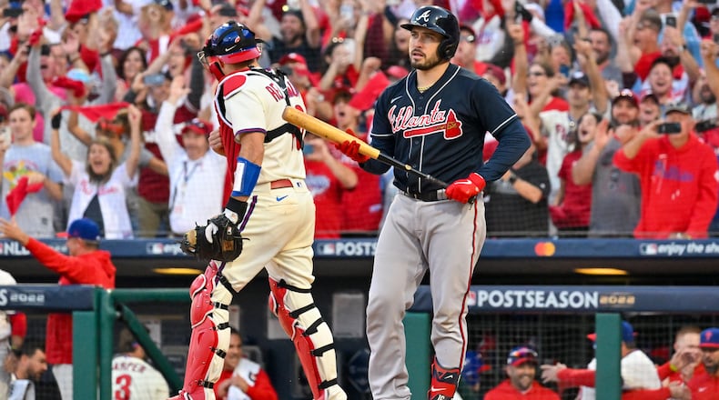 Atlanta's Travis d'Arnaud strikes out against the Phillies during the ninth inning in Game 4 of the NLDS on Saturday at Citizens Bank Park. (Hyosub Shin / Hyosub.Shin@ajc.com)