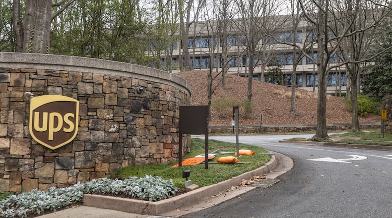 Cars arrive at 55 Glenlake Parkway NE, in Sandy Springs where office workers at UPS streamed back into work on Monday, March, 4, 2024 the first day a new policy requiring them to come into work in person five days a week took effect. The new policy, announced in January, (John Spink / John.Spink@ajc.com)