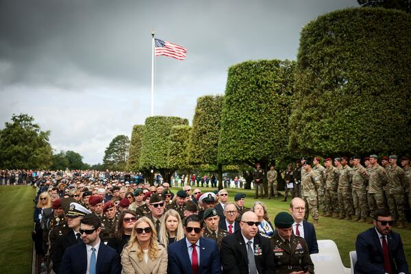 Guests attend a ceremony at the US cemetery to commemorate the 81st anniversary of the D-Day landings, Friday, June 6, 2025 in Colleville-sur-Mer, Normandy. (AP Photo/Thomas Padilla)