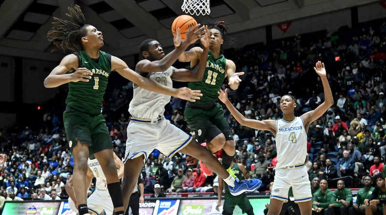 McEachern's Nnadozie Onyirimba (30) and Grayson's Cj Hyland (11) fight for a rebound during the second half of GHSA Basketball Class 7A Boy’s State Championship game at the Macon Centreplex, Saturday, Mar. 9, 2024, in Macon. Grayson won 51-41 over McEachern. (Hyosub Shin / Hyosub.Shin@ajc.com)