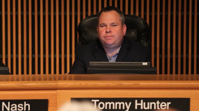 January 17, 2017, Atlanta — Gwinnett County Commissioner Tommy Hunter listens to Gwinnett residents who turned out Tuesday to rail against the “racist pig” comment that Hunter posted on Facebook about John Lewis. (Henry Taylor/ henry.taylor@ajc.com)