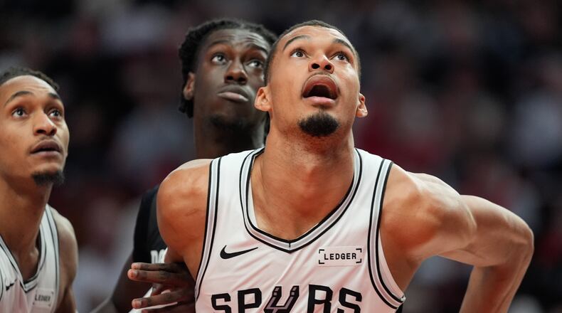 San Antonio Spurs forward/center Victor Wembanyama (1) and Portland Trail Blazers guard Sidy Cissoko watch for the rebound during the second half in Game 4 of a first-round NBA basketball playoffs series in Portland, Ore., Sunday, April 26, 2026. (AP Photo/Jenny Kane)