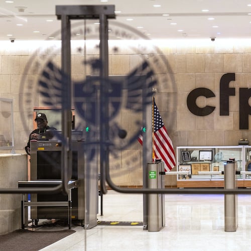 FILE - A security officer works inside of the Consumer Financial Protection Bureau (CFPB) building headquarters, Feb. 10, 2025, in Washington. (AP Photo/Jacquelyn Martin, File)