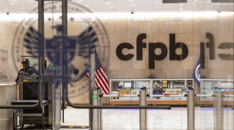 FILE - A security officer works inside of the Consumer Financial Protection Bureau (CFPB) building headquarters, Feb. 10, 2025, in Washington. (AP Photo/Jacquelyn Martin, File)