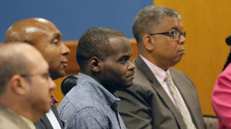 Basil Eleby (center), the homeless man accused of setting the fire that brought down a chunk of Interstate 85, was expected to be released on bond after pleading not guilty to arson and criminal trespass charges in court Tuesday morning. BOB ANDRES /BANDRES@AJC.COM