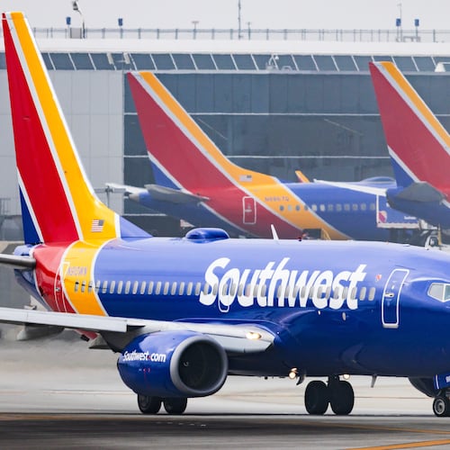 FILE - A Southwest Airlines plane is on the runway at Los Angeles International Airport on March 23, 2026, in Los Angeles. (AP Photo/Ethan Swope, File)