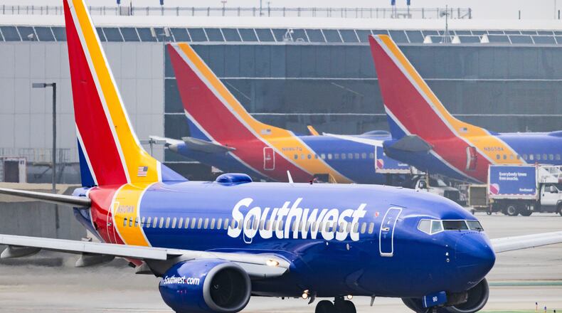 FILE - A Southwest Airlines plane is on the runway at Los Angeles International Airport on March 23, 2026, in Los Angeles. (AP Photo/Ethan Swope, File)