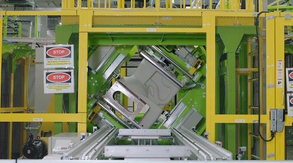 Automated systems at Toto’s Morrow plant apply glaze inside the toilet trapway, creating smooth and stain-resistant surfaces. (Courtesy of Toto USA)