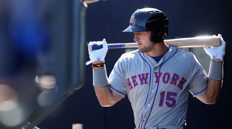 PEORIA, AZ - OCTOBER 13: Tim Tebow #15 (New York Mets) of the Scottsdale Scorpions warms up in the dugout during the Arizona Fall League game against the Peoria Javelinas at Peoria Stadium on October 13, 2016 in Peoria, Arizona. (Photo by Christian Petersen/Getty Images)
