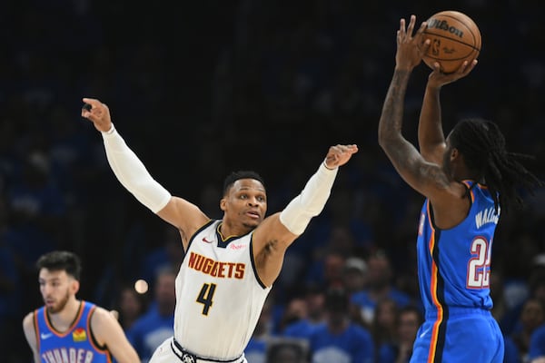 Denver Nuggets guard Russell Westbrook (4) defends against a shot by Oklahoma City Thunder's Cason Wallace (22) in the first half of Game 7 in the Western Conference semifinals of the NBA basketball playoffs, Sunday, May 18, 2025, in Oklahoma City. (AP Photo/Kyle Phillips)