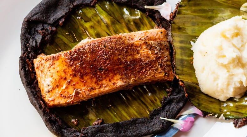Salmon Prehispánico at Casi Cielo is served still encased in a tortilla and plantain leaf, to be revealed tableside. It comes with mashed potatoes. CONTRIBUTED BY HENRI HOLLIS