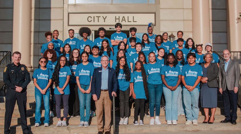 Lawrenceville Legacy Leaders is an intensive 8-month youth leadership program with a vision to cultivate a legacy of leaders in Lawrenceville. Through volunteer opportunities, mental health discussions, interactions with local government leaders, leadership development, public speaking workshops and the coordination of community events, the program aims to promote student success and resiliency while increasing civic awareness and understanding among the youth. Shown here is the 2024 youth leaders with city leaders. (Courtesy City of Lawrenceville)