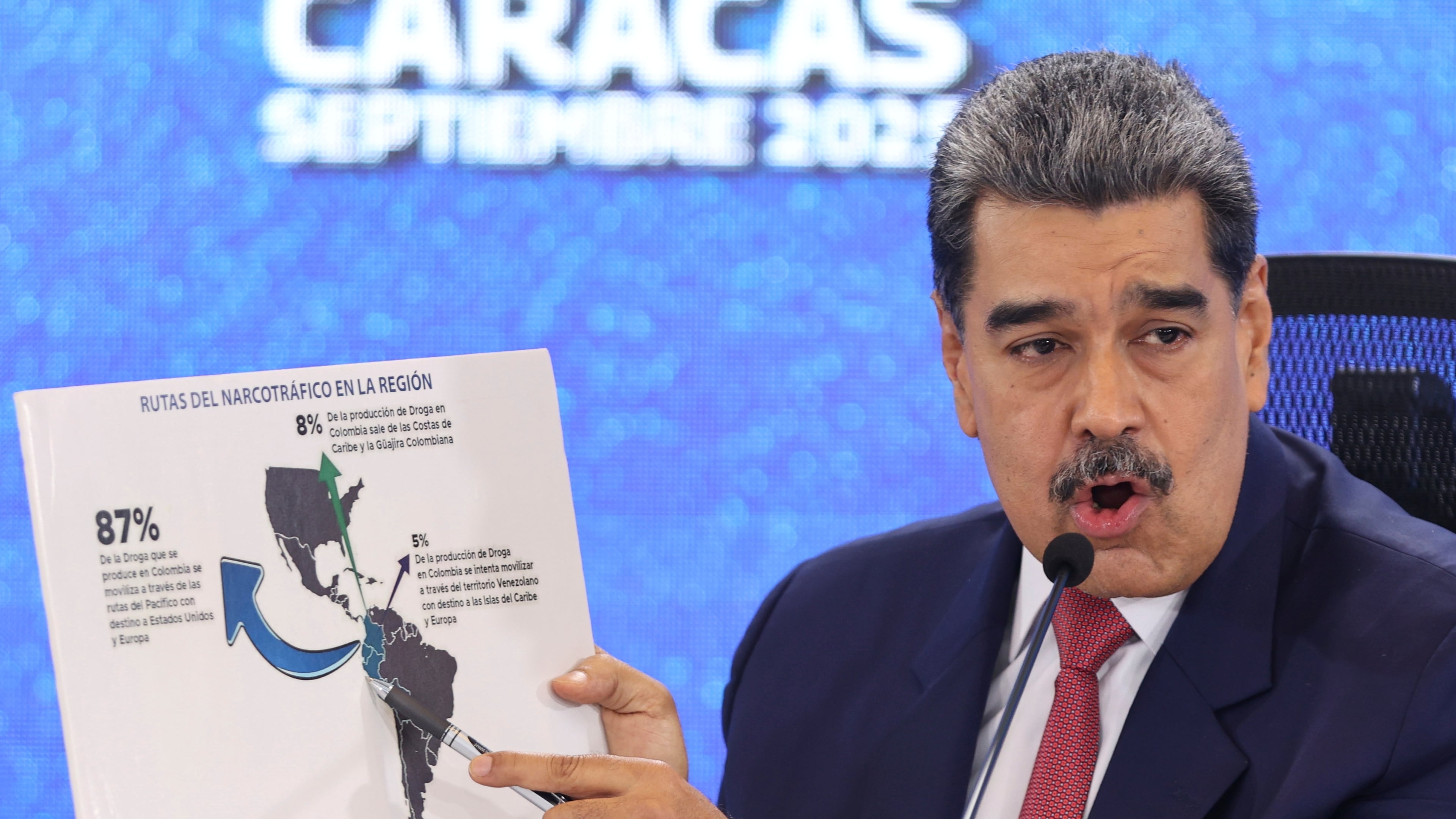 Venezuelan President Nicolas Maduro points at a map of the Americas during a press conference in Caracas, Venezuela, Monday, Sept 15, 2025. (AP Photo/Jesus Vargas)