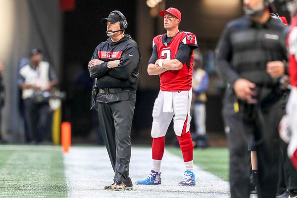 Falcons head coach Dan Quinn and quarterback Matt Ryan watch the defense during the second half against the Baltimore Ravens Sunday, Dec. 2, 2018, at Mercedes-Benz Stadium in Atlanta.
