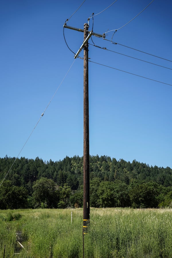 A power line connected to the grid stands in Calistoga, Calif., Tuesday, May 27, 2025. It will carry electricity from a backup system powered by hydrogen and batteries. (AP Photo/Annika Hammerschlag)