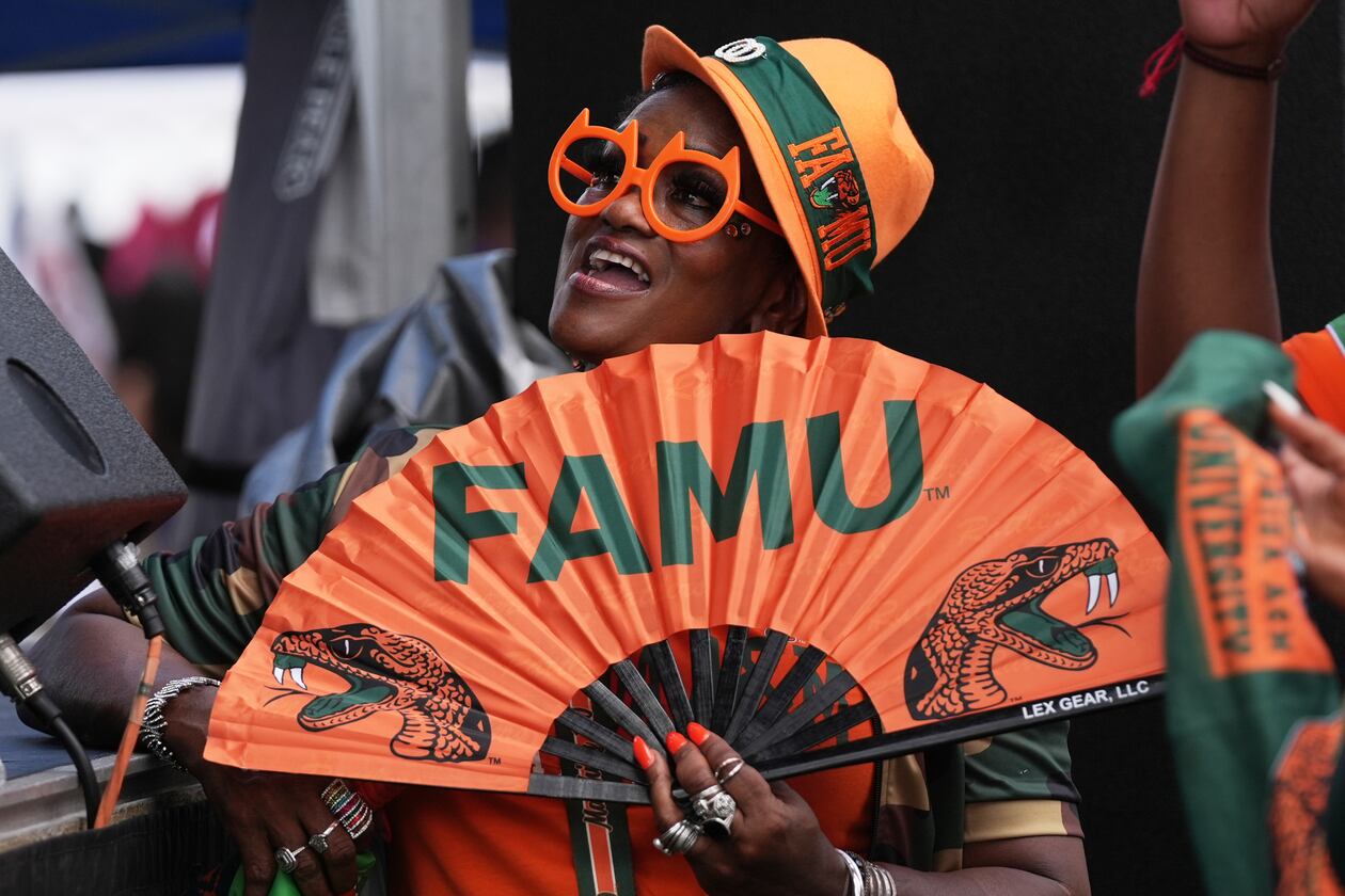 A Florida A&M fan listens to entertainment at a fan fest before the Orange Blossom Classic between Florida A&M and South Carolina State on Sunday, Sept. 6, 2026, in Miami Gardens, Fla. (Lynne Sladky/AP)