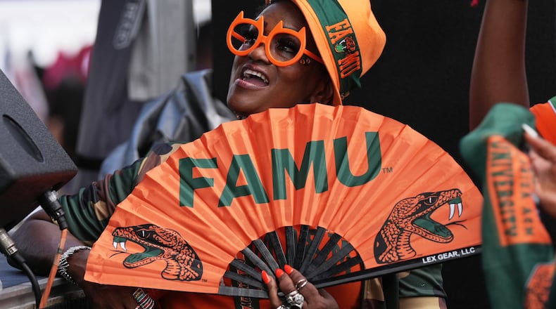 A Florida A&M fan listens to entertainment at a fan fest before the Orange Blossom Classic between Florida A&M and South Carolina State on Sunday, Sept. 6, 2026, in Miami Gardens, Fla. (Lynne Sladky/AP)