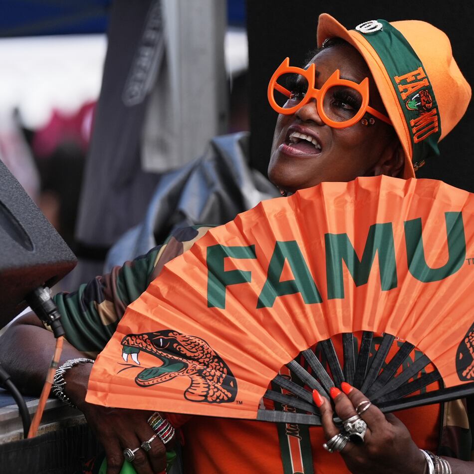 A Florida A&M fan listens to entertainment at a fan fest before the Orange Blossom Classic between Florida A&M and South Carolina State on Sunday, Sept. 6, 2026, in Miami Gardens, Fla. (Lynne Sladky/AP)