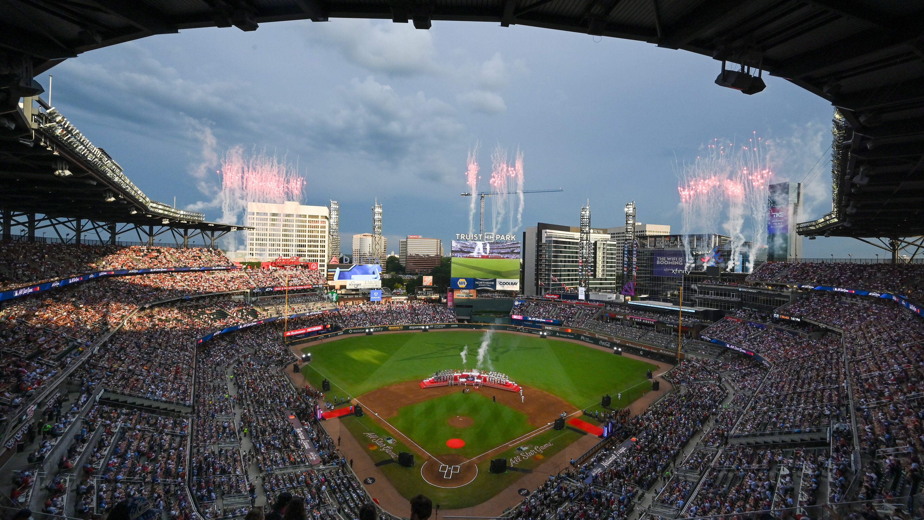Fireworks illuminate the north Atlanta skyline as members of Zac Brown Band and Lauren Spencer Smith sing the U.S. and Canadian National Anthems, respectively. To open the MLB All-Star Game on Tuesday. (Hyosub Shin/AJC)