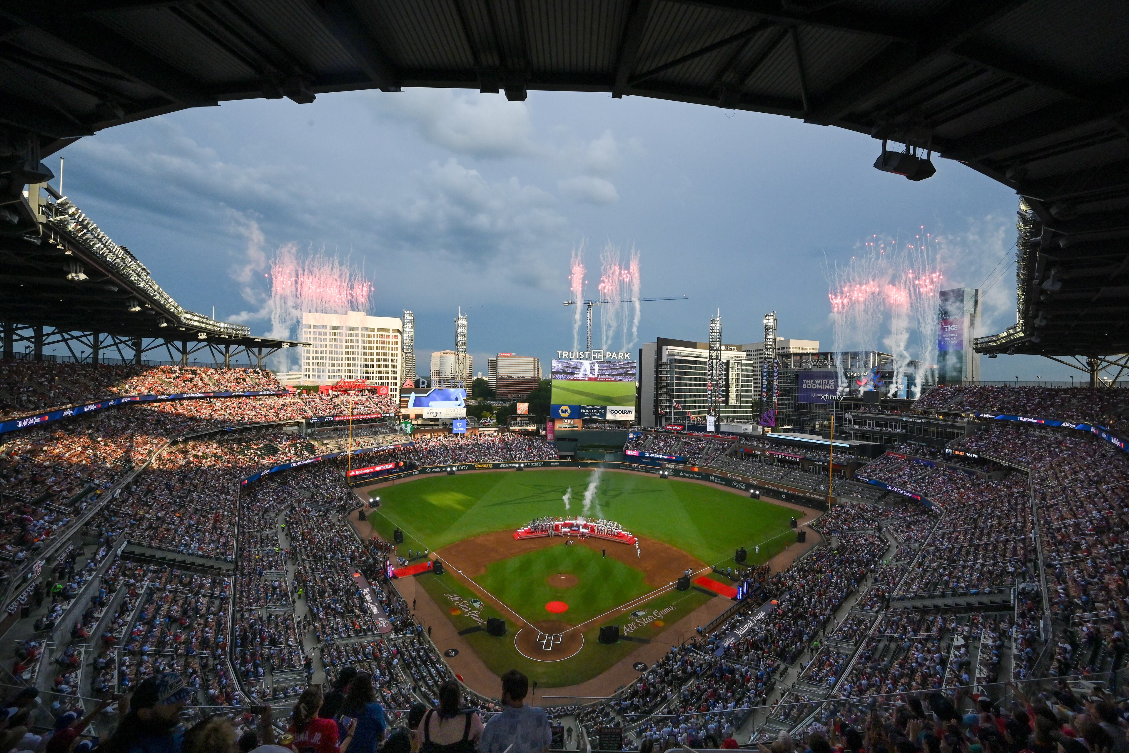 Fireworks illuminate the north Atlanta skyline as members of Zac Brown Band and Lauren Spencer Smith sing the U.S. and Canadian national anthems, respectively, to help open the MLB All-Star Game at Truist Park in Atlanta on Tuesday, July 15, 2025. (Hyosub Shin/AJC)