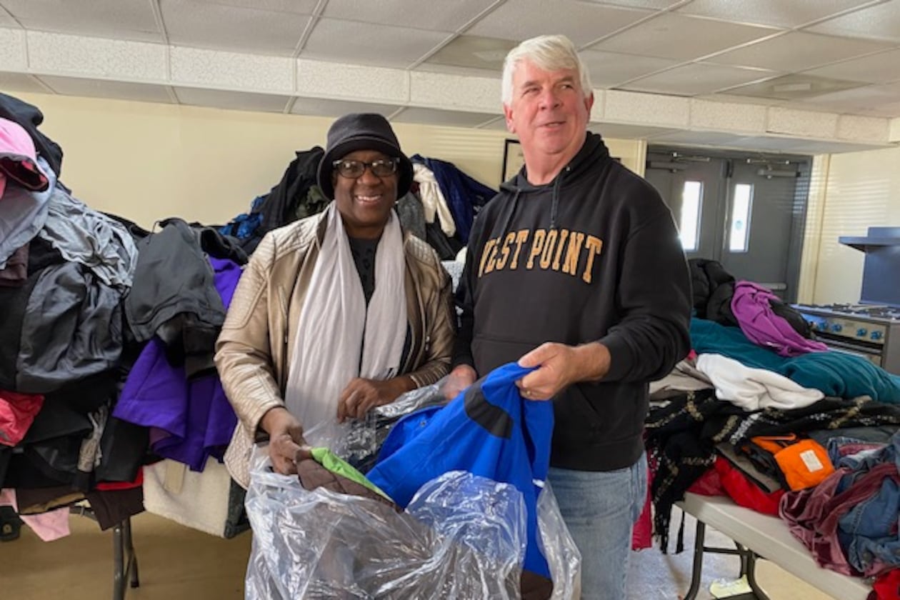 Cherokee County Homeless Veterans Program founder Jim Lindenmayer helps pack the thousands of new and gently used coats donated to the program. The coats are given away to homeless veterans and to local schools. (Courtesy of Jim Lindenmayer)