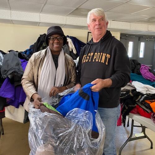 Cherokee County Homeless Veterans Program founder Jim Lindenmayer helps pack the thousands of new and gently used coats donated to the program. The coats are given away to homeless veterans and to local schools. (Courtesy of Jim Lindenmayer)